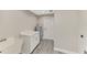 Functional laundry room with ample counter space and a utility sink for convenience at 1183 Cedar Ave, Englewood, FL 34223