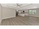 Open concept living area featuring gray floors, tray ceiling, and island kitchen at 1183 Cedar Ave, Englewood, FL 34223