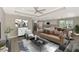 Staged open concept living area with modern furnishings and integrated kitchen at 1183 Cedar Ave, Englewood, FL 34223