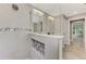 Modern walk-in shower featuring gray tile, mosaic accents, and a glass partition at 1183 Cedar Ave, Englewood, FL 34223