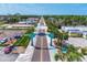 Aerial shot of Dearborn Street lined with businesses and greenery, showcasing a quaint commercial area at 1183 Cedar Ave, Englewood, FL 34223