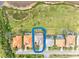 An aerial view of the property highlights its location, screened-in pool, and outdoor space at 14026 Royal Pointe Dr, Port Charlotte, FL 33953