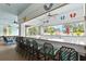Poolside bar featuring ample counter seating, outdoor views, and a relaxed, tropical vibe at 14026 Royal Pointe Dr, Port Charlotte, FL 33953
