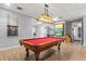 Billiards room featuring a pool table, and decorative lighting for a relaxed and entertaining space at 14026 Royal Pointe Dr, Port Charlotte, FL 33953
