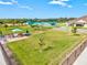 Scenic green space with seating and recreational opportunities for community members at 14026 Royal Pointe Dr, Port Charlotte, FL 33953