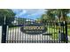 Elegant gated entrance to Riverwood Beach Club provides security and curb appeal at 14026 Royal Pointe Dr, Port Charlotte, FL 33953