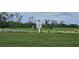 Golfers practice in a designated teaching area on the golf course at 14026 Royal Pointe Dr, Port Charlotte, FL 33953