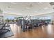 Bright gym with updated exercise equipment, machines, and floor to ceiling windows at 14026 Royal Pointe Dr, Port Charlotte, FL 33953