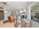 Open-concept kitchen flows into the dining area and offers stainless appliances and ample counter space at 14026 Royal Pointe Dr, Port Charlotte, FL 33953