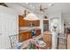 Spacious kitchen features stainless steel appliances, warm wood cabinetry, and a breakfast bar at 14026 Royal Pointe Dr, Port Charlotte, FL 33953