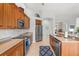 Well-appointed kitchen featuring stainless appliances, ample cabinet space, and a tiled backsplash at 14026 Royal Pointe Dr, Port Charlotte, FL 33953