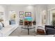 Inviting living room is furnished with a glass table and a comfortable seating arrangement at 14026 Royal Pointe Dr, Port Charlotte, FL 33953