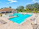 Enjoy the Florida sun at this community pool with ample seating and pristine blue water at 14026 Royal Pointe Dr, Port Charlotte, FL 33953