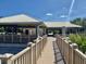 Community recreation area features covered seating and a lovely boardwalk at 14026 Royal Pointe Dr, Port Charlotte, FL 33953