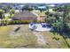 This backyard has a shed, a trailer parking spot, and a wooden fence separating the neighbor's yard at 14157 Kewanee Ln, Port Charlotte, FL 33981