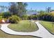 Backyard featuring a fire pit and tropical landscaping at 14157 Kewanee Ln, Port Charlotte, FL 33981