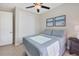 Comfortable bedroom featuring tile floors, ceiling fan, and closet at 14157 Kewanee Ln, Port Charlotte, FL 33981