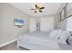 Bedroom with a ceiling fan, TV, closet, and white color scheme at 14157 Kewanee Ln, Port Charlotte, FL 33981