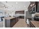 Modern kitchen featuring stainless steel appliances, granite countertops, and an island at 14157 Kewanee Ln, Port Charlotte, FL 33981