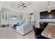 Comfortable living room with tile flooring, a wet bar, and large comfortable seating at 14157 Kewanee Ln, Port Charlotte, FL 33981