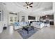 Open-concept living space with tile floors, tray ceilings, and seamless transition to the kitchen at 14157 Kewanee Ln, Port Charlotte, FL 33981