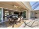 A covered patio, perfect for outdoor dining and entertaining, opens to the living room at 14157 Kewanee Ln, Port Charlotte, FL 33981