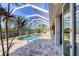 Screened-in pool and jacuzzi offer a relaxing backyard retreat at 14157 Kewanee Ln, Port Charlotte, FL 33981