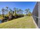 Peaceful water view along property line, enhanced by serene landscaping and natural beauty at 14157 Kewanee Ln, Port Charlotte, FL 33981