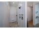 Modern bathroom featuring a spacious walk-in shower with dual showerheads, pebble floor, and built-in shelving at 14718 San Domingo Blvd, Port Charlotte, FL 33981