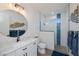 Modern bathroom with a glass shower, stylish round mirror, and a vessel sink vanity at 14718 San Domingo Blvd, Port Charlotte, FL 33981