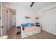 Bedroom featuring a twin bed, coastal artwork, and a ceiling fan at 14718 San Domingo Blvd, Port Charlotte, FL 33981