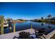 Dock with boat lift and seating area overlooking the canal at 14718 San Domingo Blvd, Port Charlotte, FL 33981
