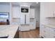 Bright and airy kitchen features sleek white cabinets and modern stainless steel appliances at 14718 San Domingo Blvd, Port Charlotte, FL 33981