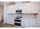 Bright kitchen with custom cabinets, double oven, and stylish backsplash for a modern aesthetic at 14718 San Domingo Blvd, Port Charlotte, FL 33981