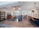 Open-concept living room features coffered ceilings, wood floors, and seamless flow to the kitchen and entryway at 14718 San Domingo Blvd, Port Charlotte, FL 33981