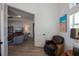 View from den showing open living area with TV, seating and decor with beachy accents at 14718 San Domingo Blvd, Port Charlotte, FL 33981