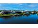 Waterfront homes on canal with private docks and boat lifts on a sunny day at 14718 San Domingo Blvd, Port Charlotte, FL 33981