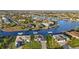 Aerial view of waterfront homes, canals, and lush landscaping at 15044 Acorn Cir, Port Charlotte, FL 33981