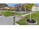 Waterfront backyard with screened-in pool, dock, and manicured lawn at 15044 Acorn Cir, Port Charlotte, FL 33981