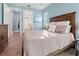 Inviting bedroom featuring a large bed, serene decor, and a window with natural light at 15044 Acorn Cir, Port Charlotte, FL 33981