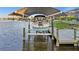 Covered boat lift on the canal at 15044 Acorn Cir, Port Charlotte, FL 33981