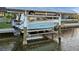 Boat lift on canal with cover provides protection for your vessel at 15044 Acorn Cir, Port Charlotte, FL 33981