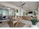 Covered lanai features a dining area and lounge area with a seamless transition to the indoor living space at 15044 Acorn Cir, Port Charlotte, FL 33981