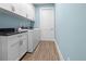 Bright laundry room featuring modern appliances and ample storage at 15044 Acorn Cir, Port Charlotte, FL 33981