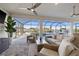 Inviting outdoor living space with comfortable seating and scenic views of the pool and waterfront at 15044 Acorn Cir, Port Charlotte, FL 33981