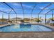 Screened in lanai showcases a pool, spa, and a beautiful waterfront view at 15044 Acorn Cir, Port Charlotte, FL 33981