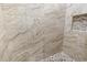 Close-up of the shower showcasing the beautiful tile work and mosaic-tiled shower floor with a built-in niche at 15044 Acorn Cir, Port Charlotte, FL 33981