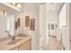 Bathroom with double sinks, framed art, tile floors and ensuite at 16 Windward Ter, Placida, FL 33946