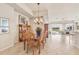 Cozy dining space with chandelier, a view to the living room and beautiful backyard, perfect for Gathering gatherings at 16 Windward Ter, Placida, FL 33946