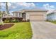 Charming single-Gathering home featuring a two-car garage, well-maintained lawn, and attractive landscaping at 16 Windward Ter, Placida, FL 33946